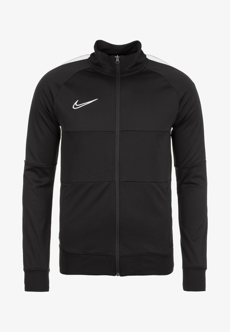 Veste de sport noire Nike zippée avec col haut, manches longues et logo Swoosh blanc sur la poitrine gauche.