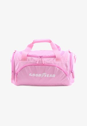 Pink duffel bag with two top handles, zippered compartments, and prominent white "GOODYEAR" logo on the front. Soft fabric, sturdy design.