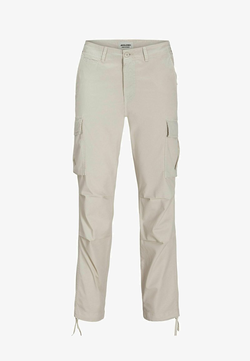 Beige tehernadrág könnyű anyagból, oldalsó zsebekkel, állítható szegővel és egyenes szárú kialakítással. Gombos és cipzáras záródás.