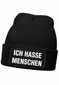 Black knit beanie with ribbed texture featuring a rectangular patch that reads "ICH HASSE MENSCHEN" in bold white letters.