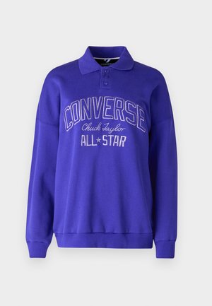Lila Sweatshirt mit Kragen, langen Ärmeln und gerippten Bündchen. Mit geprägt "CONVERSE Chuck Taylor ALL STAR" Schriftzug auf der Vorderseite.