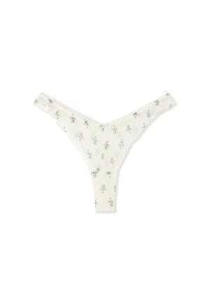 Tanga con stampa floreale in crema chiaro, realizzato in tessuto morbido. Presenta piccole fantasie di fiori multicolori e un delicato bordo in pizzo sui lati.