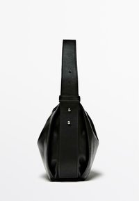 Black leather handbag with a curved shape, flat bottom, and a long handle. Features silver hardware and visible stitching details.