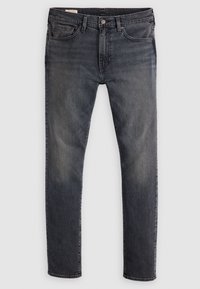 Mörk tvättade denimjeans med slim fit, fem fickor och metallknappstängning. Tyget har en något blekt textur och rak passform.