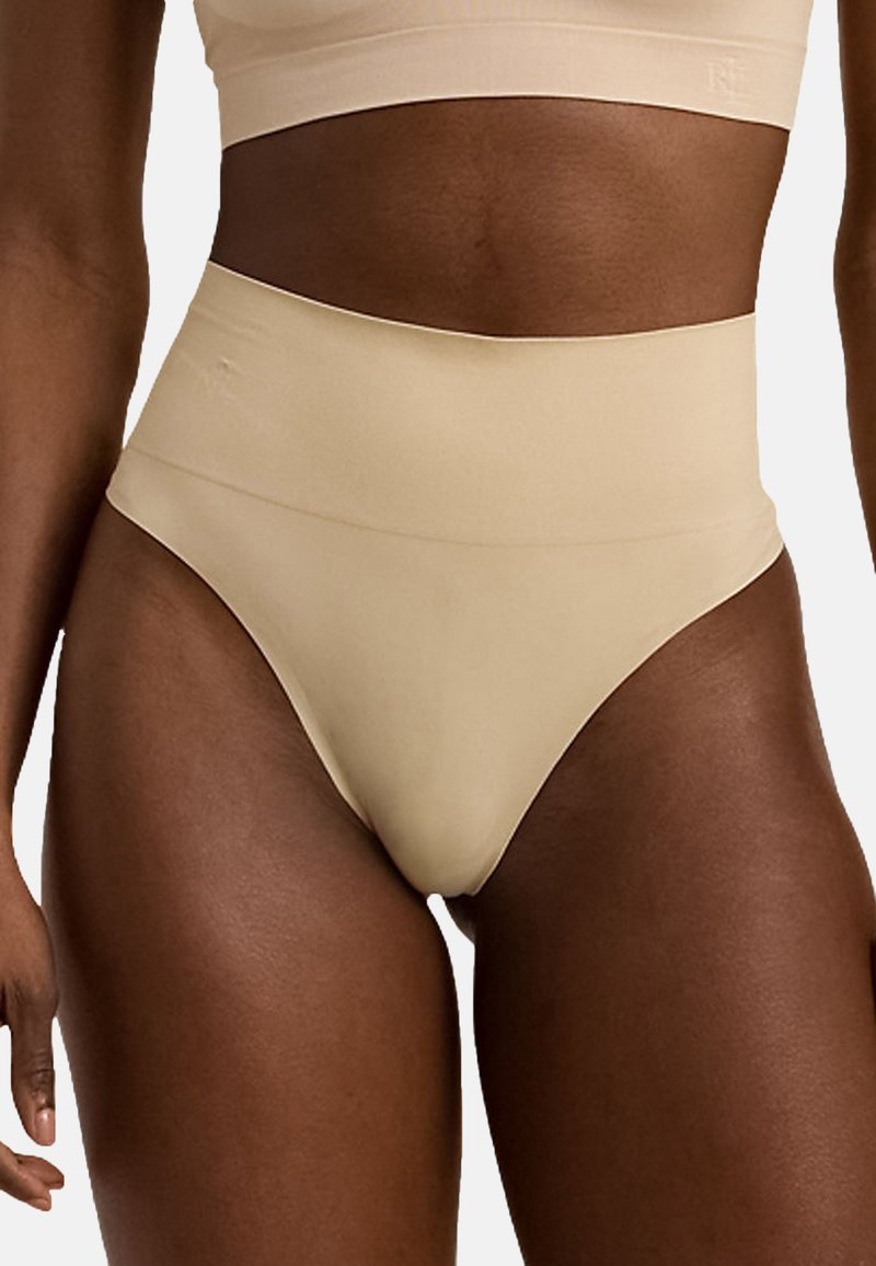 Höga, hudfärgade underkläder i en mjuk och elastisk tyg. Har en bred midjeband för komfort och en sömlös design.