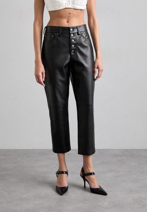 KOONS BUTTON - Leather trousers - black