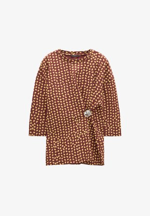 Brązowa bluzka w żółty wzór w kropki, z rękawami do łokcia i bocznym zapięciem na guziki. Miękka tkanina, luźny krój i zaokrąglony dekolt.