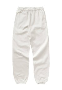 Vita, mjuka joggers i tyg med elastisk midja, elastiska cuffs och sidofickor. Har diskret varumärkestryck på låret.