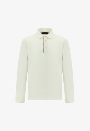 Lange mouwen polo shirt in gebroken wit. Kenmerkt zich door een klassieke kraag met drie knopen, zacht materiaal en strakke lijnen. Geen zichtbare patronen of accenten.