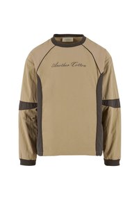 Beige long-sleeve top with dark brown accents, featuring raglan sleeves and embroidered "Another Cotton" text on the front. Smooth texture.