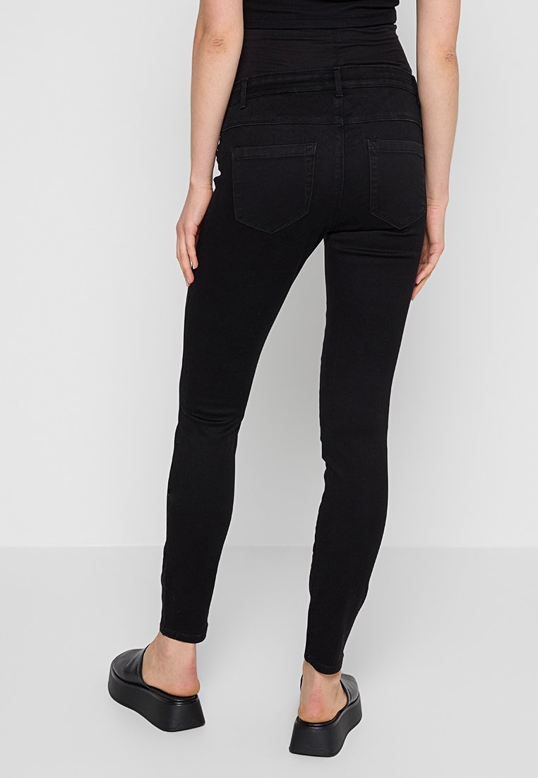 Schwarze, enge Jeans mit hoher Taille und Gesäßtaschen. Hergestellt aus einem dehnbaren Baumwollgemisch, mit glatter Textur und schlanker Passform.