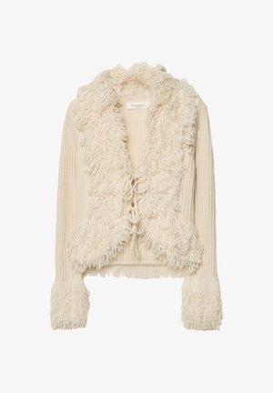 Krémová skrátená bunda s huňatým, štruktúrovaným golierom a manžetami; obsahuje rebrovaný pletený dizajn a viazanie vpredu.