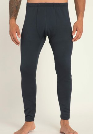 Leggings bleu marine foncé en tissu extensible, avec un design ajusté, une taille élastique et des détails de couture visibles le long des coutures.