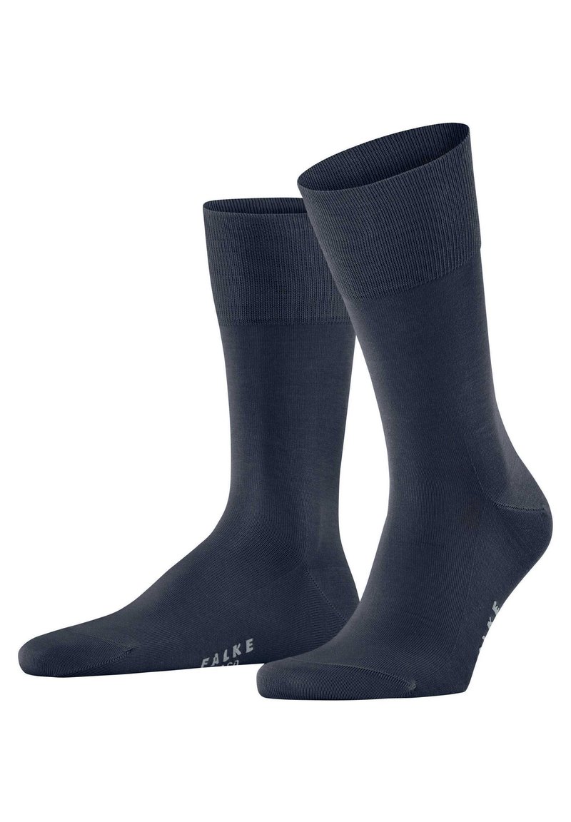 Mörk marinblå strumpor i ett mjukt, stretchigt material. Har ribbade muddar, slät textur och förstärkt tåområde.