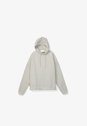 Light beige hooded sweatshirt with long sleeves, front kangaroo pocket, and drawstring cords against a white background.