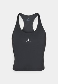 Brassière de sport noire avec un col rond et un design dos nageur. Présente un logo Jumpman blanc sur la poitrine. Fabriquée en tissu lisse et élastique.