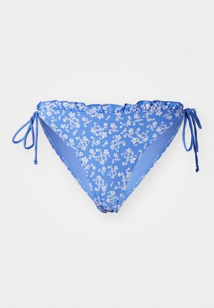 Blue floral bikini bottom with a ruffled waistband, side ties, and contrasting blue panels. Made of smooth, stretch fabric.