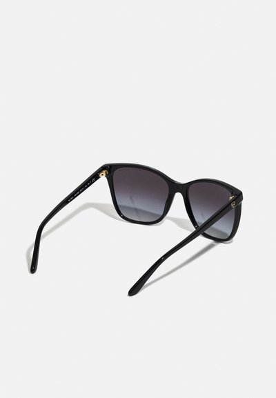 Black sunglasses with a gradient lens, sleek rectangular frames, and gold accents on the temples. Smooth plastic material.