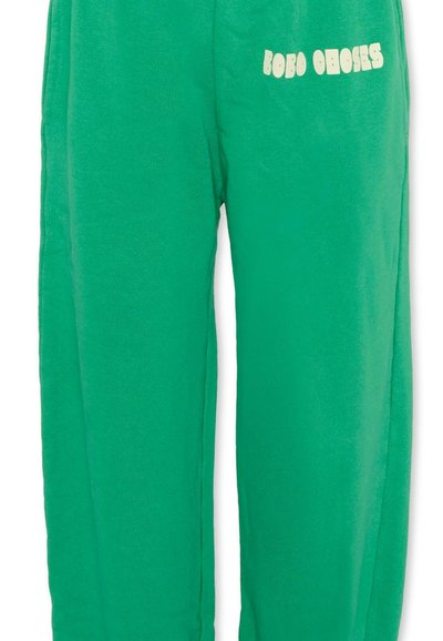Zielone spodnie dresowe z polaru z elastycznym pasem i białym napisem "BOBO CHOSES" na górnej części uda.