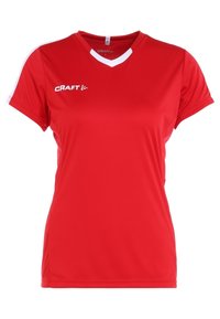 Rød sports T-shirt lavet af letvægtsstof, med V-hals design, korte ærmer og hvide detaljer på skuldrene. Logo på forsiden.