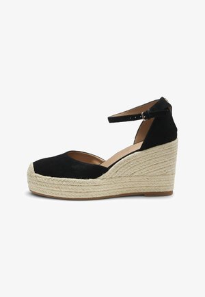 Black suede wedge espadrille with ankle strap and braided jute platform sole.