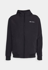 Black hooded jacket made of smooth material, featuring a full zipper and elastic cuffs. Small white logo on the chest.