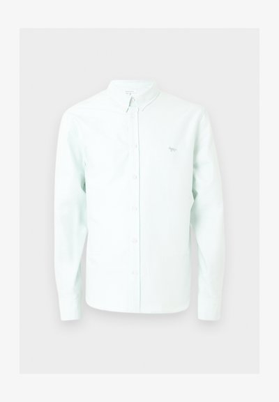 Λευκό πουκάμισο με μακριά μανίκια σε ανοιχτό μπλε χρώμα, με γιακά και μικρό κεντημένο λογότυπο αλεπούς στο αριστερό στήθος.