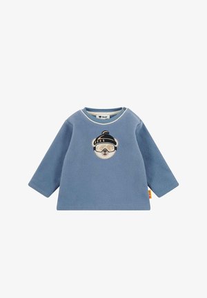 Modré fleecové tričko s dlouhým rukávem pro miminka, na kterém je vyšité medvědí, který nosí zimní čepici a lyžařské brýle, na hrudi.