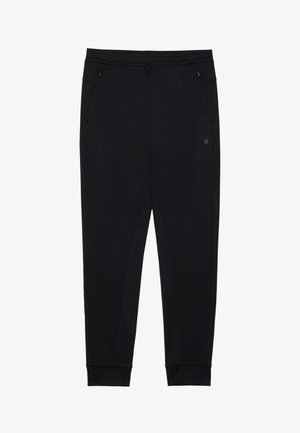Crne sweatpants od mekog materijala s elastičnom waistbandom. Ima bočne džepove i sužene manžetne za čvrst fit.