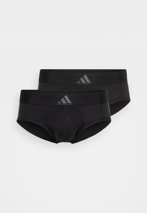 Sorte bomullsboxer med en glatt tekstur og elastisk linning med en subtil grå logo. To par er lagd oppå hverandre.