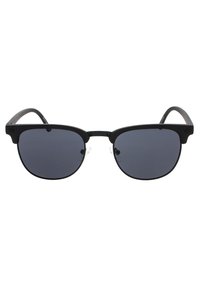 Gafas de sol negras con lentes redondos y un marco grueso. El diseño presenta una ceja prominente y almohadillas nasales transparentes para mayor comodidad.