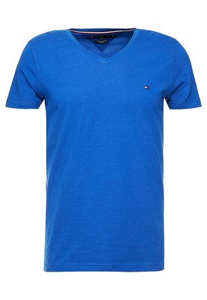 Blue v-neck t-shirt made of smooth cotton fabric, featuring short sleeves and a small logo on the chest. Simple and fitted design.