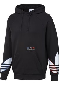 Svart hoodie med en ficka fram, vita och röda detaljer på ärmarna och broderad "adidas" logotyp på bröstet. Tillverkad av mjukt tyg.