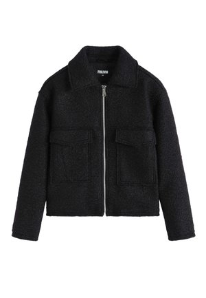 Veste en mélange de laine noire avec fermeture éclair, deux poches avant et un col classique. Tissu texturé avec une coupe droite.