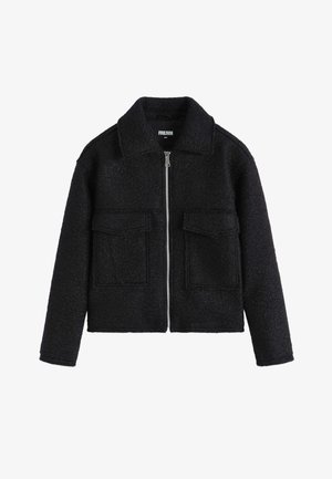 Veste en mélange de laine noire avec fermeture éclair, deux poches avant et un col classique. Tissu texturé avec une coupe droite.