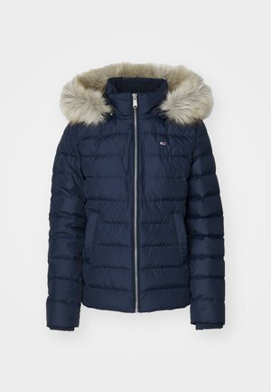 Navy puffer jacket with a faux fur hood, quilted design, zip closure, and two front pockets. Features ribbed cuffs for added warmth.