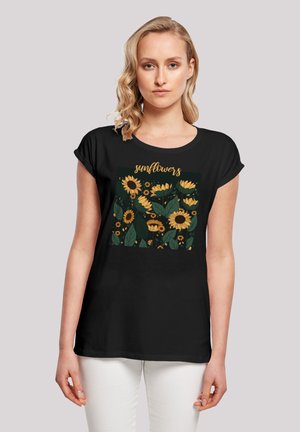Black short-sleeve t-shirt with a graphic print featuring sunflowers and green leaves. Soft fabric with a relaxed fit.