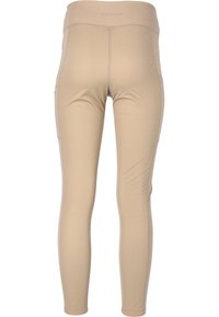 Leggings beiges en tissu extensible, dotés d'une taille haute, de poches latérales et de coutures sans coutures pour un confort et une flexibilité accrus.