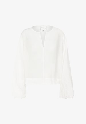 Hvid linned-top med rund halsudskæring, drop-sleeves, en forreste nøglehul og en kortet kant. Glat tekstur og letvægtsdesign.