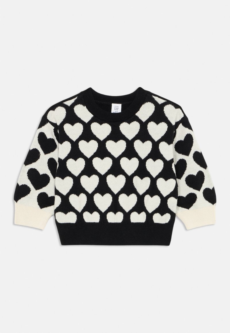 Pull noir à motif de cœurs blancs, manches longues, poignets et col côtelés, présenté sur un fond blanc uni.