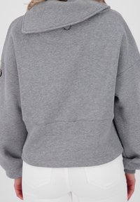 Grauer Kapuzenpullover mit lockerem Sitz, angesetzten Schultern und gerippten Bündchen. Verfügt über ein kleines Logo auf der Rückseite und eine weiche Baumwollstruktur.