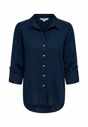 Tume sinine pika varrukaga särk kraega, esiküljel kuus beeži nööpi ja käärutatavate varrukatega, millel on nööbiga kinnitused.