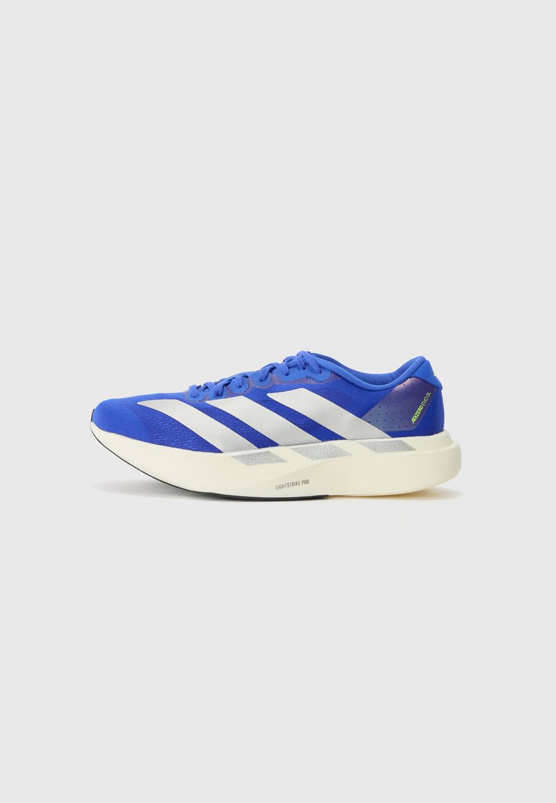 Blue running shoe featuring a mesh upper, prominent white stripes, and a textured outsole. Accented with green and gray details.