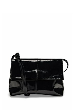 Black glossy leather crossbody bag with a fold-over flap and adjustable strap against a white background.