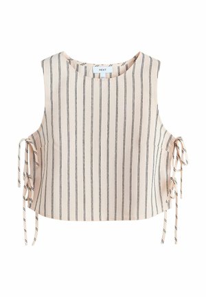 Beige ærmeløs croptop med lodrette sorte striber og bindedetaljer i siderne på begge sider.