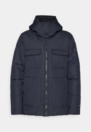 Marineblå puffjakke med hette, med glidelås foran, to brystlommer og quiltet design. Laget av et teksturert, syntetisk materiale.