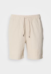Short beige texturé mi-genou avec taille élastique et cordon sur fond uni.
