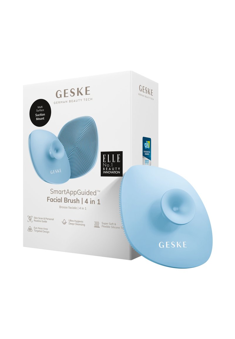 Helle blaue Silikon-Gesichts Bürste mit Saugnapf. Texturierte Oberflächengestaltung. Die Verpackung zeigt Produktdetails und Auszeichnungen.