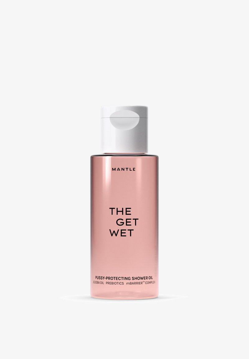 Gennemsigtig lyserød flaske med bruseolie med hvid hætte mærket "Mantle The Get Wet," indeholdende jojobaolie, præbiotika og mBarrier-kompleks.