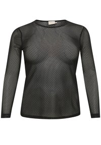 Haut noir à manches longues en maille avec un motif à pois. Col rond et coupe ajustée. Le tissu semble léger et légèrement transparent.